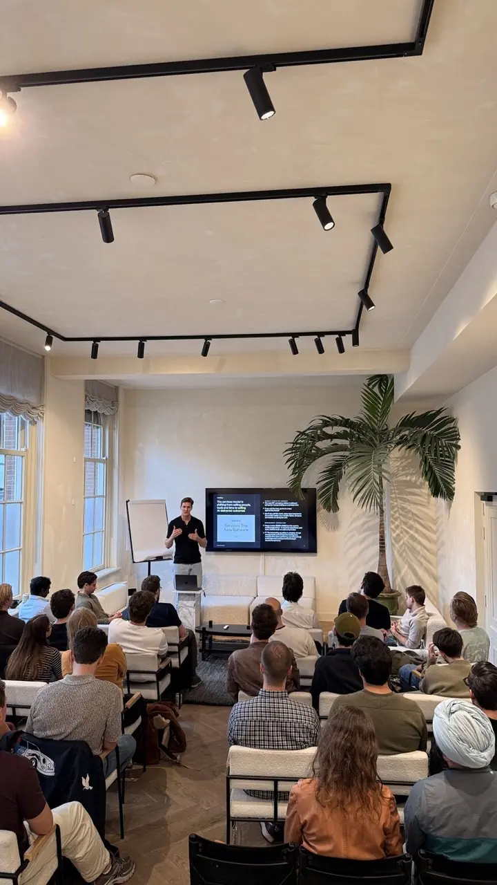 Agency founders and operators seated for the “Services: The New Software” talk at a Clawnify event for AI-native agencies.